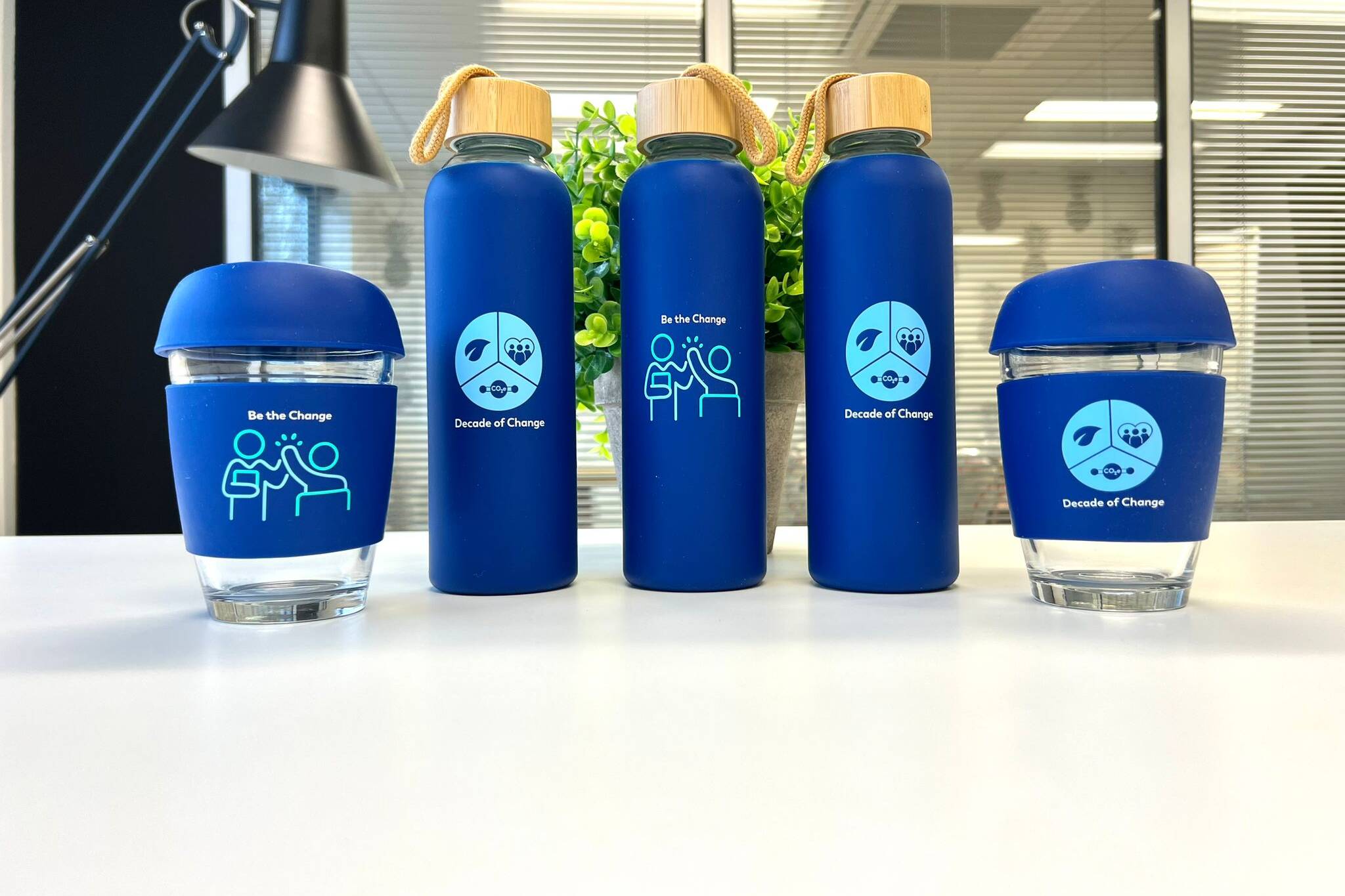 Gatwick Branded Merchandise: Glass Bottle & Glass Coffee Cup With Printed ‘Be the Change’ Slogan