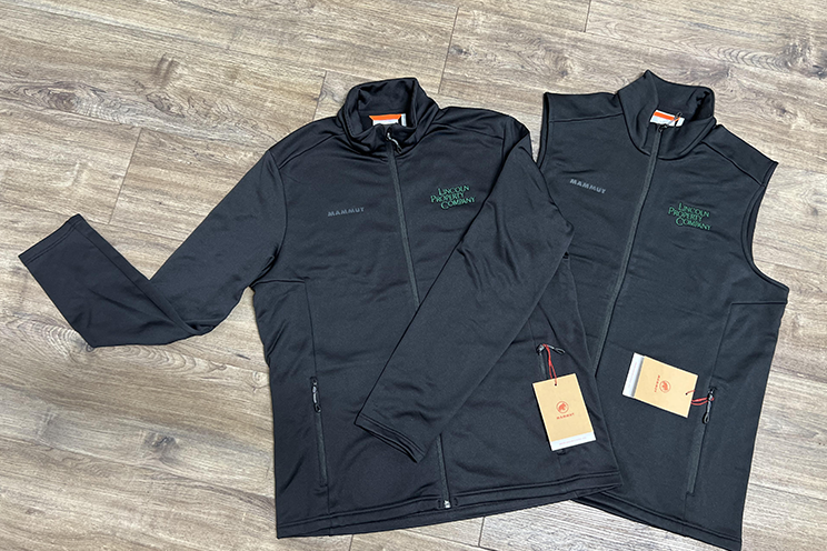 Both black jackets showing cobranding between mammut garments and lincoln property company